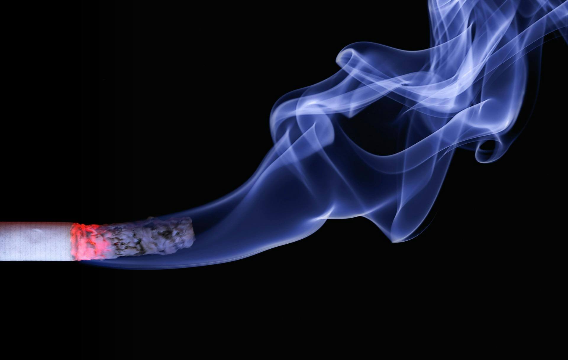 Burning cigarette symbolizing final smoking attempt. Your last cigarette?