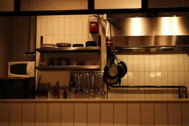 Neatly arranged kitchen with utensils and appliances within easy reach